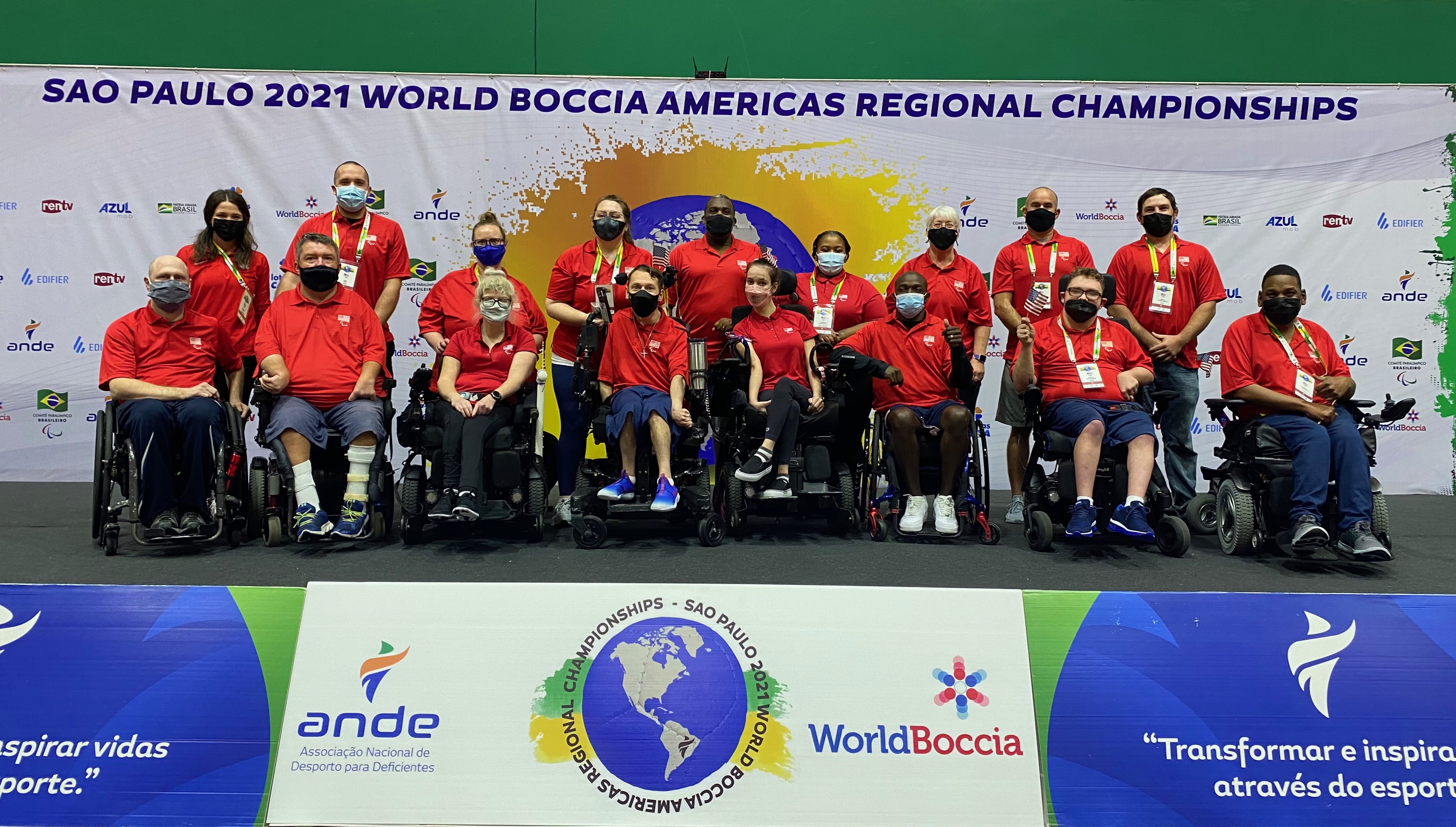 Team USA athletes and staff smile for team picture