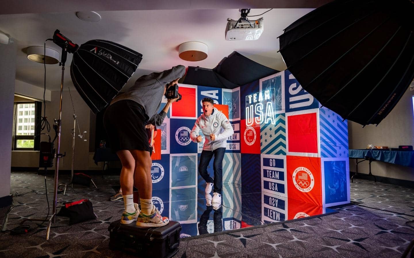 Trenten Merrill, Paralympic Track and Field Athlete, flexes for a Team USA photo shoot