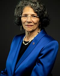 Headshot of Anita DeFrantz in blue blazer