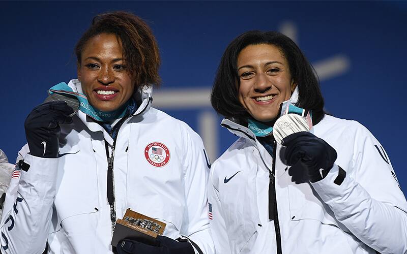 Elana Meyers Taylor (right) and Lauren Gibbs hold their silver medals during the two-woman bobsled medal ceremony at the Olympic Winter Games PyeongChang 2018.