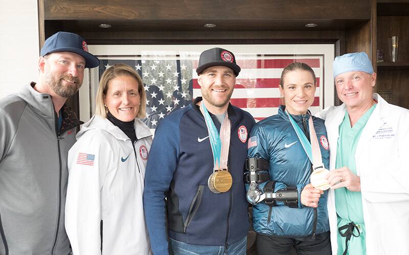 Oksana Masters and Mike Schultz pose with Dr. Marc Philippon, Vice President of U.S. Paralympics Julie Dussliere and Director of Para Alpine High Performance Kevin Jardine.