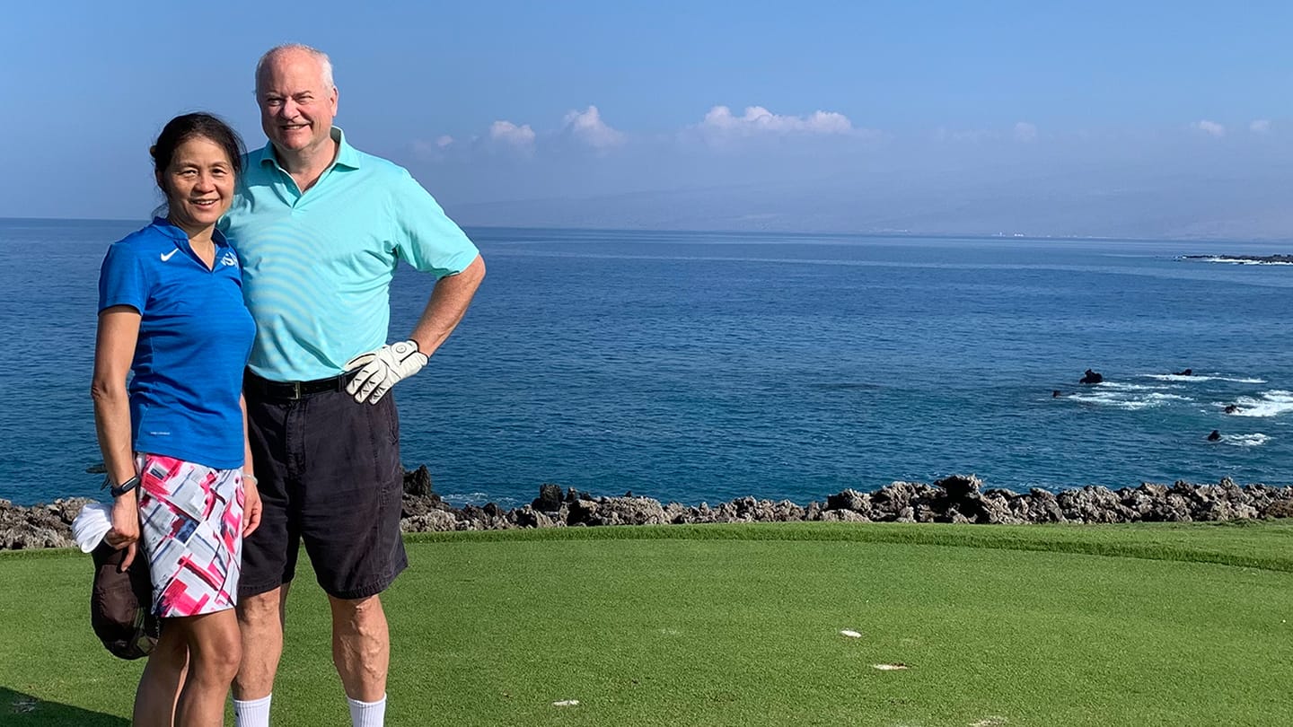 Yucca and Gary Rieschel with a scenic landscape