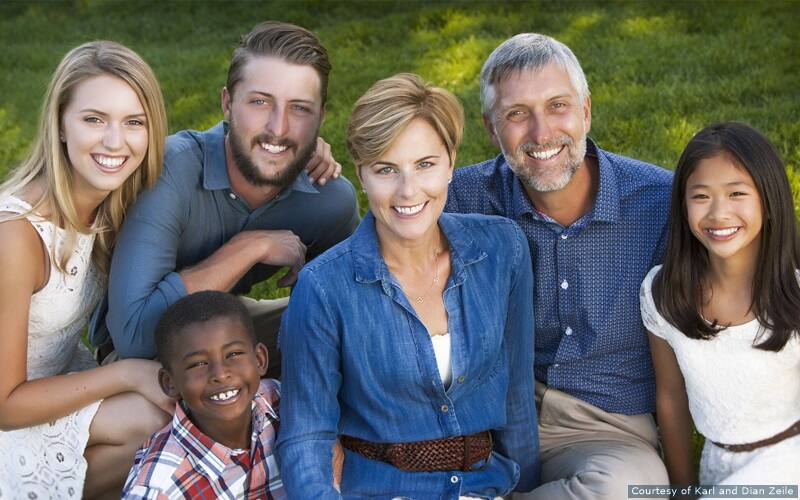 Karl and Dian Zeile pose for a family photo with their children.