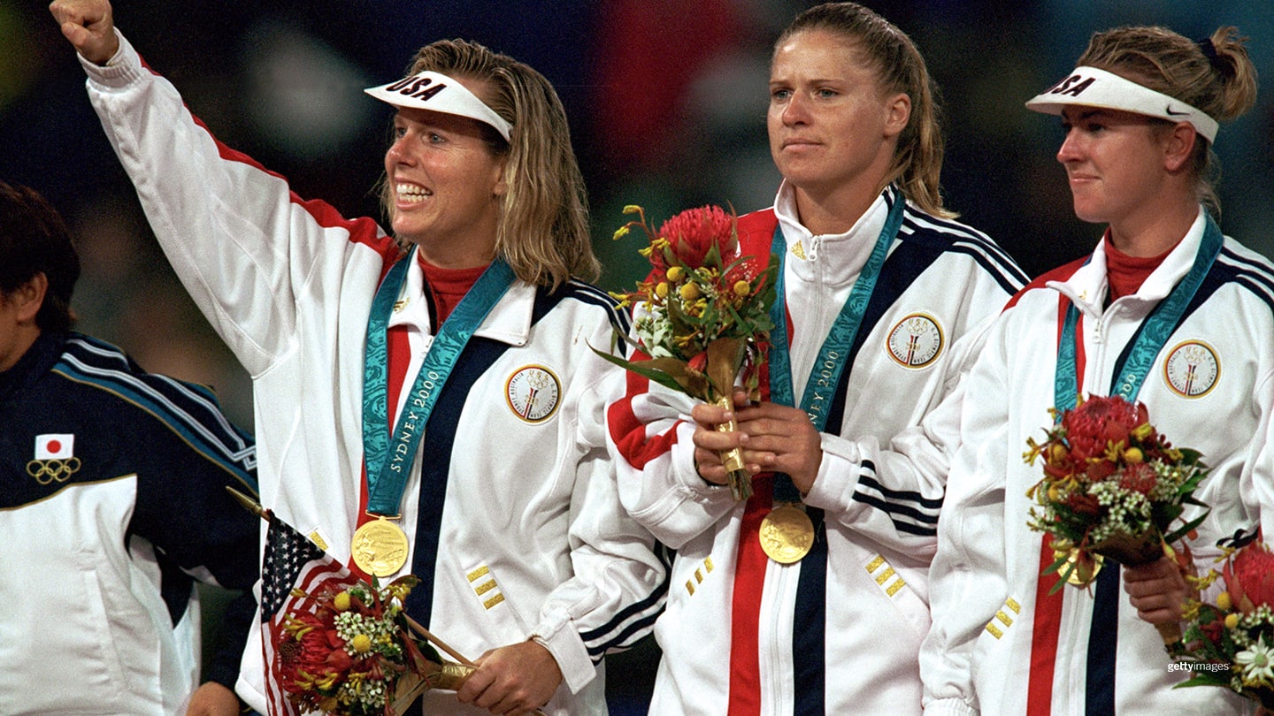 Second baseman Dot Richardson #1 (far left) and US Olympic Softball Team celebrate after defeating the Japanese, by a score of 2-1, for the 2000 Sydney Olympic gold medal, in New South Wales, Australia, on September 26, 2000. (