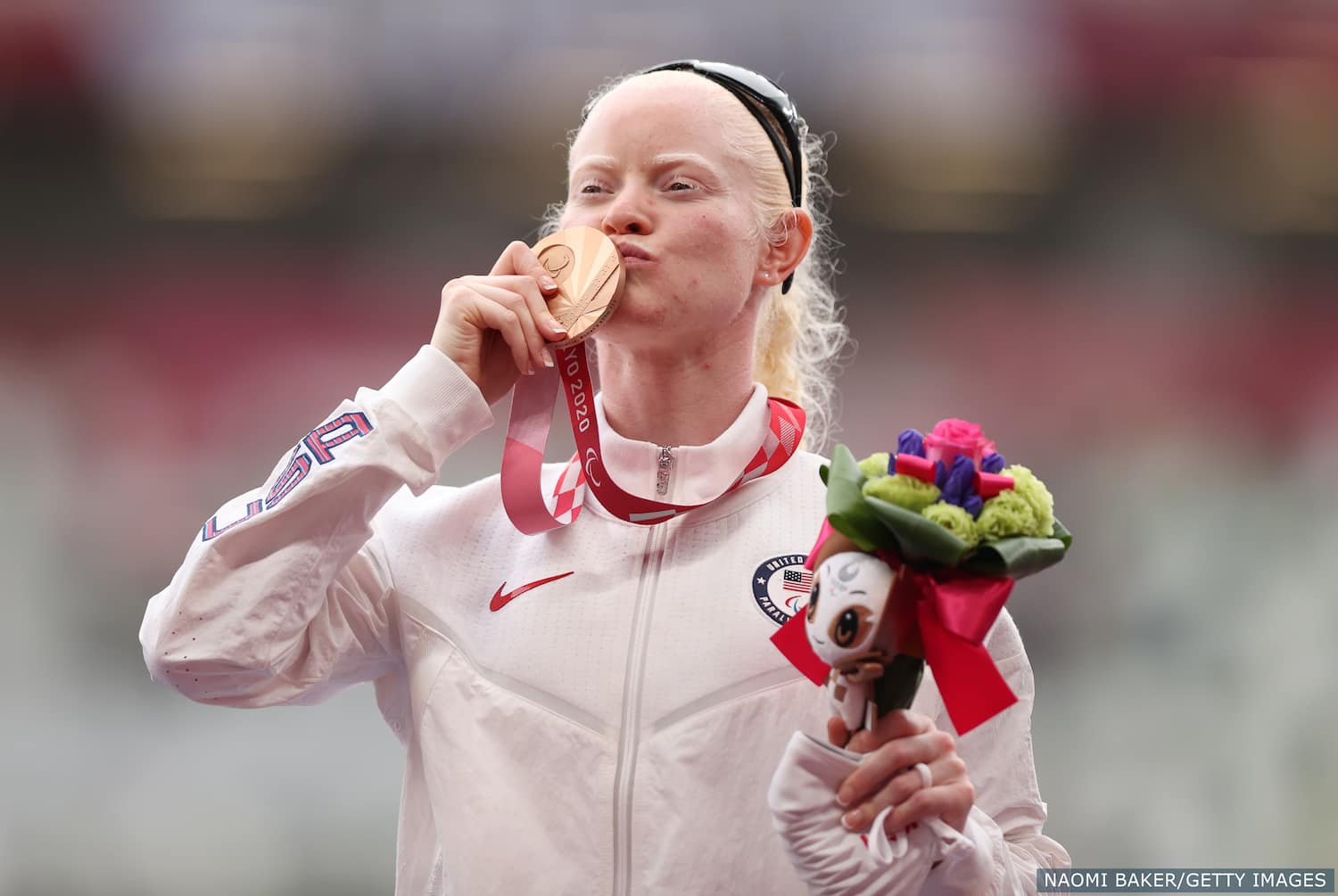 Kym Crosby celebrates winning bronze in para track and field for Team USA at the Tokyo Paralympics