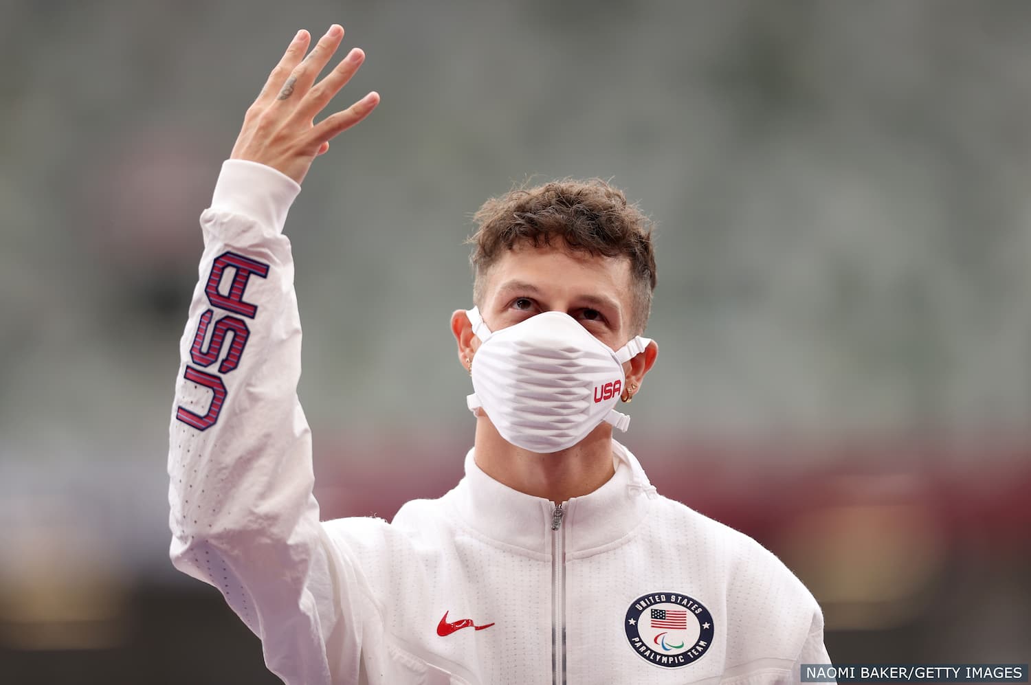 Nick Mayhugh celebrates winning gold in para track and field for Team USA at the Tokyo Paralympics