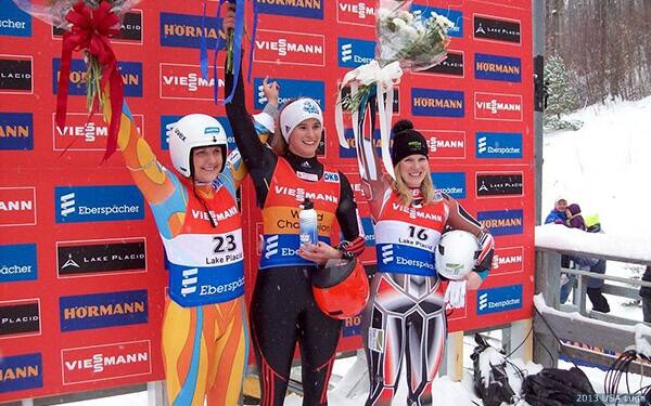 (L-R) Silver medalist Julia Clukey of the United States, gold medalist Natalie Geisenberger of Germany and bronze medalist Alex Hough of Canada celebrate at the FIL Luge World Cup in Lake Placid, N.Y., on Feb. 8, 2013.