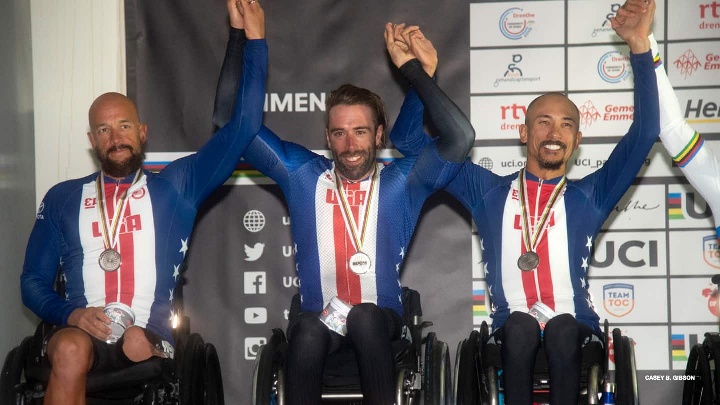 Tom Davis, Brandon Lyons and Will Groulx pose on the podium at the 2019 UCI Para-Cycling Road World Championships. 