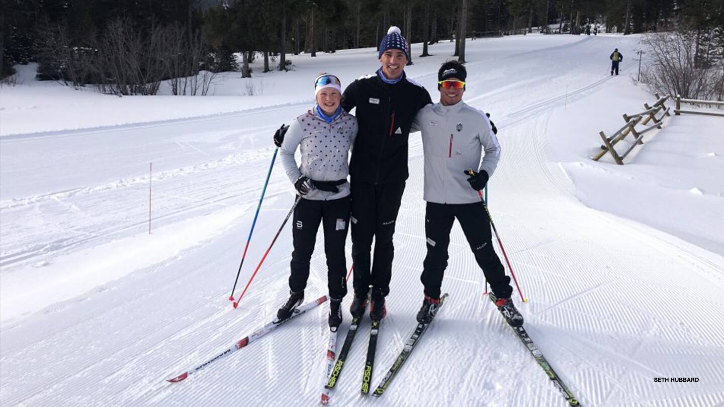 Nick Michaud poses with Crosscut Elite Athletes Hannah Cole and Ruslan Reiter. 