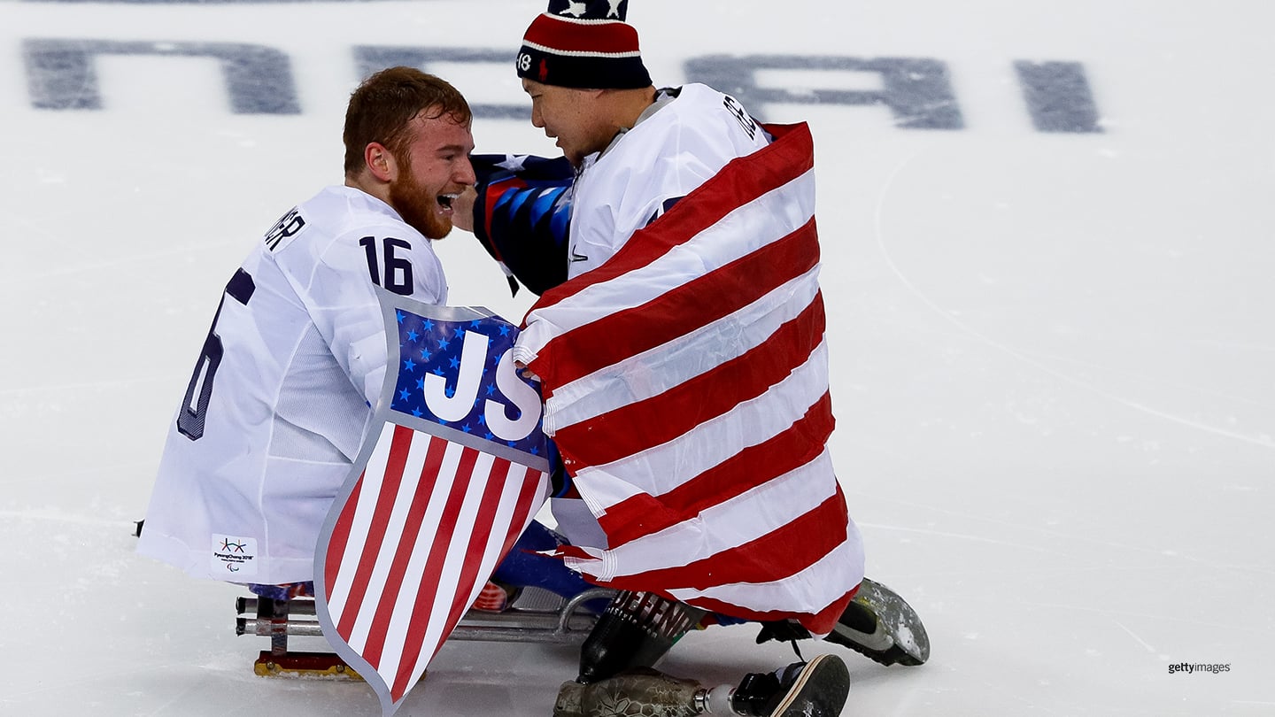 Declan Farmer and a goalkeeper Jen Lee celebrate the gold medal after winning in the Ice Hockey gold medal game at the PyeongChang 2018 Paralympic Games on March 18, 2018 in Gangneung, South Korea.