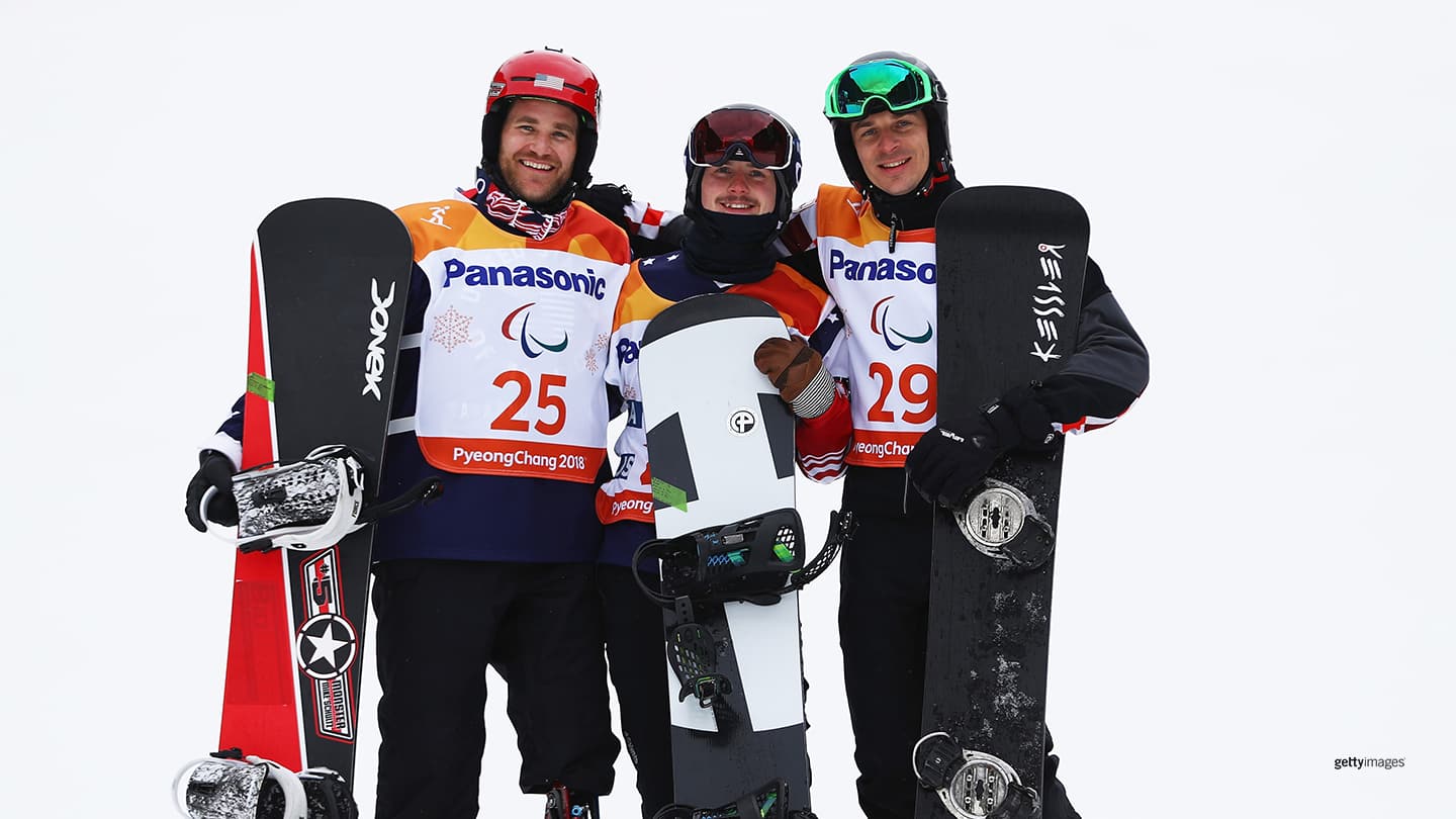 Silver Medalist Mike Schultz, Gold Medalist Noah Elliot and Bronze medalist Bruno Bosnjak of Croatia pose during the victory ceremony for the Men's Snowboard Banked Slalom SB-LL1 at the PyeongChang 2018 Paralympic Games on March 16, 2018 in Pyeongchang-gun, South Korea.