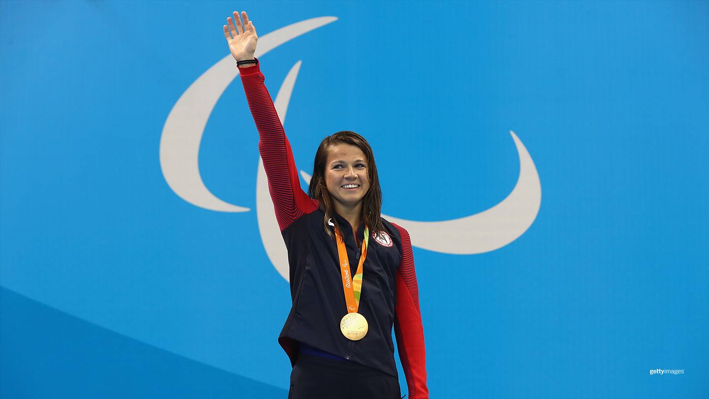 Gold medalist Rebecca Meyers celebrates on the podium at the medal ceremony for Women's 100m Butterfly - S13 at the Rio 2016 Paralympic Games on Sept. 8, 2016 in Rio de Janeiro, Brazil. (