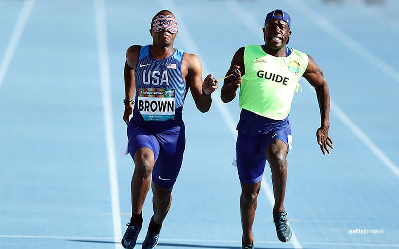 David Brown and guide Jerome Avery compete in the Men's 100m T11 during the Men's T13 Long Jump at the IPC World Para Athletics Championships 2019 Dubai on Nov. 12, 2019 in Dubai.