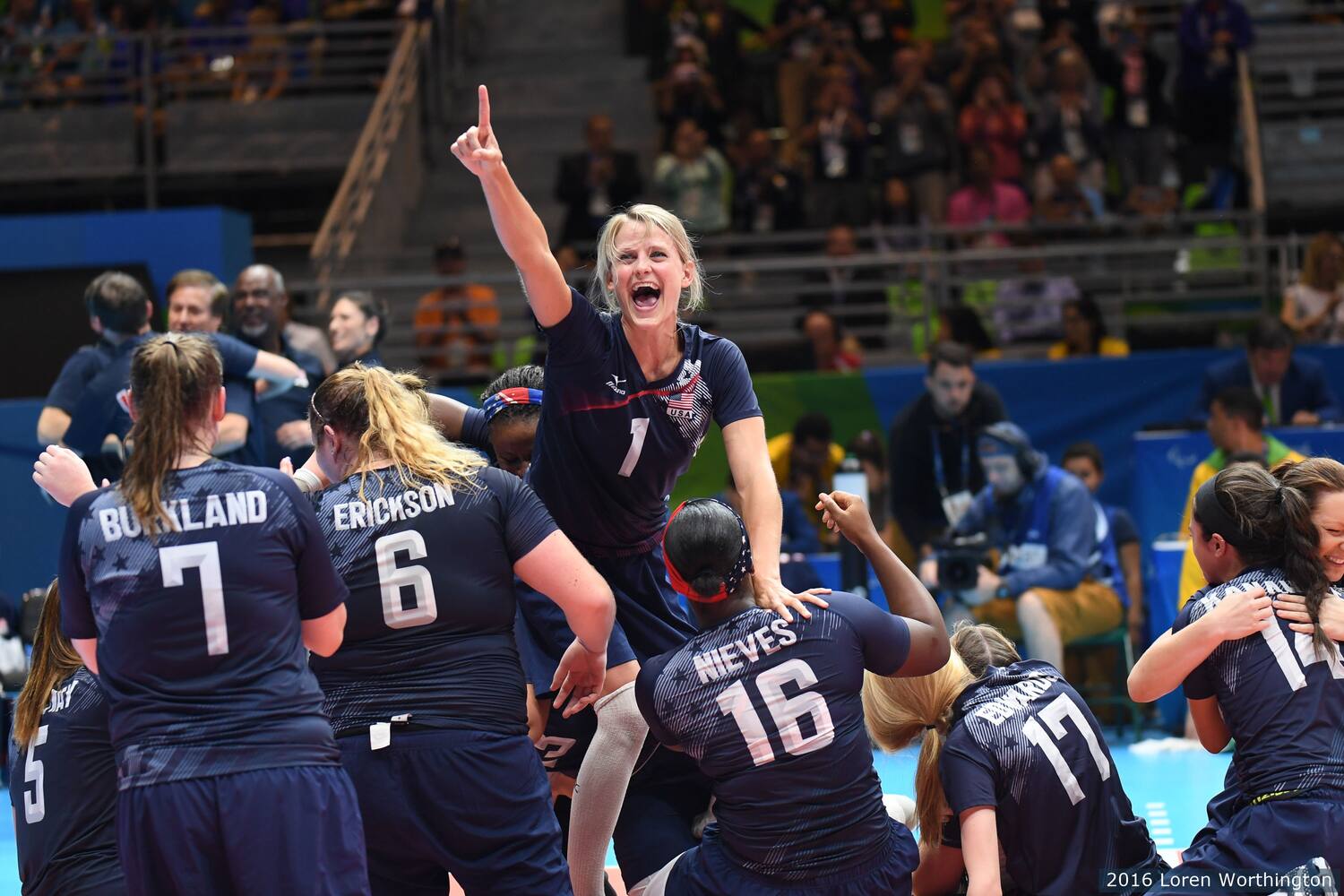 Members of the 2016 Women's Sitting Volleyball team celebrate after winning the gold medal in Rio. 