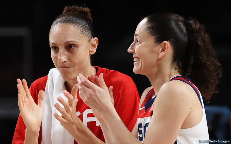 U.S. basketball players Diana Taurasi (left) and Sue Bird celebrate after defeating Serbia in the semifinals at the 2020 Olympic Games.