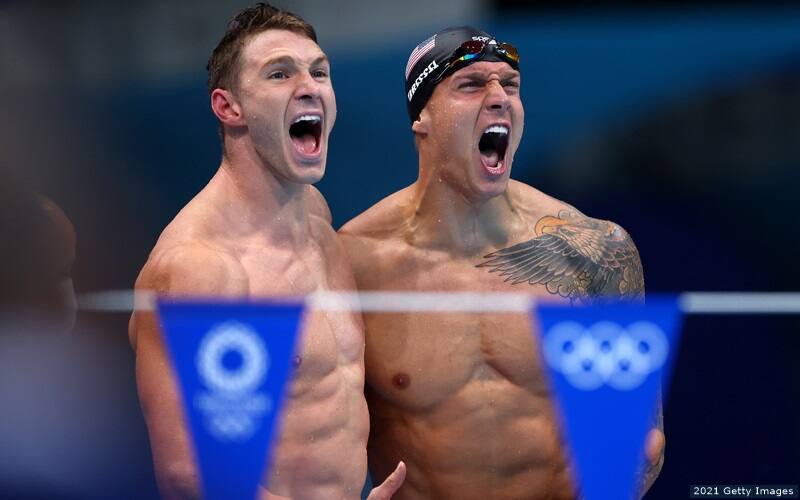 U.S. swimmers Ryan Murphy (left) and Caeleb Dressel react to their world record and gold medal performance in the men's 4x100 medley relay in Tokyo.