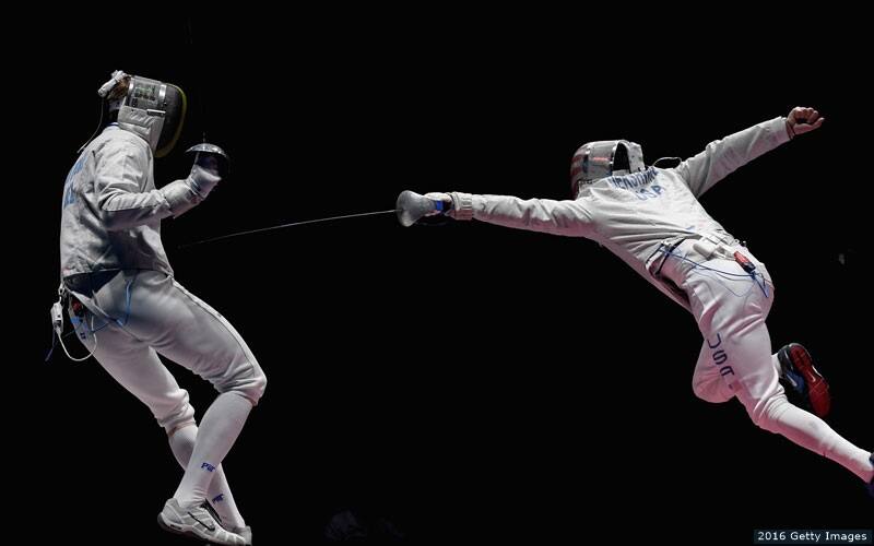 American fencer Eli Dershwitz lunges at an opponent during the 2016 Olympics.
