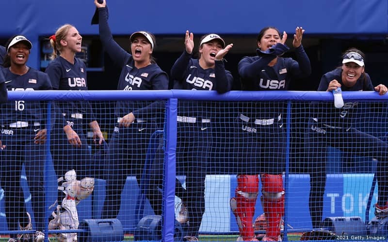 From left to right: Michelle Moultrie, Aubree Munro, Madilyn Nickles, Rachel Garcia, Dejah Mulipola and Janette Reed of the U.S. Olympic softball team cheer on teammates against Japan.