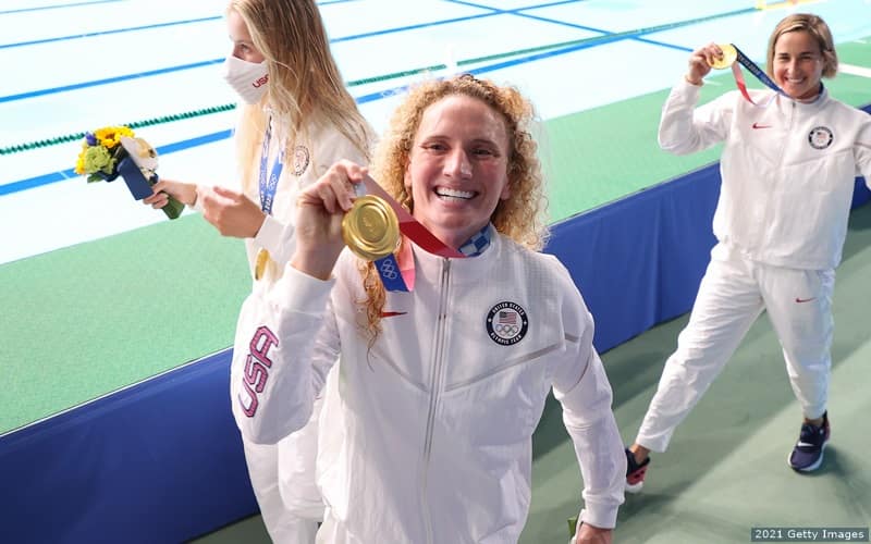 U.S. water polo attacker Kaleigh Gilchrist poses with her gold medal from the 2020 Olympic Games. 