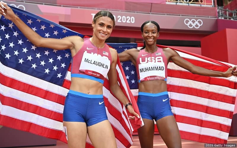 Sydney Mclaughlin (left) and Dalilah Muhammad of the U.S. celebrate winning gold and silver, respectively, in the women's 400-meter hurdles at the 2020 Olympic Games. 