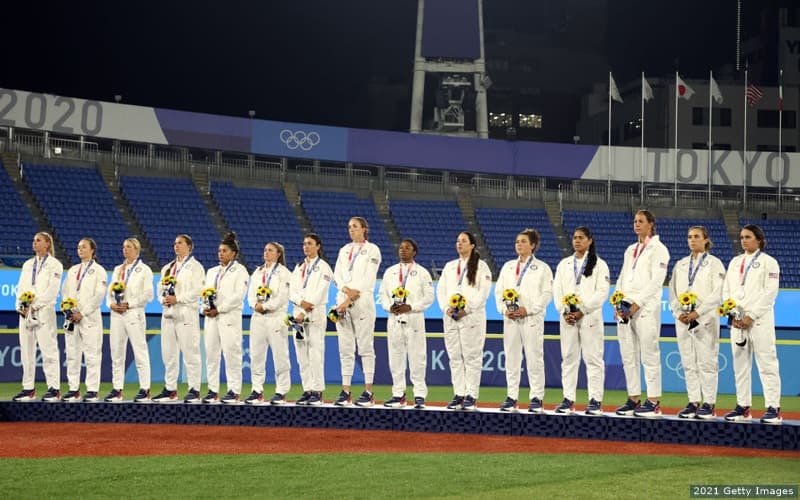Members of the U.S. softball team receive silver medals after losing 2-0 to Japan in the gold medal game.