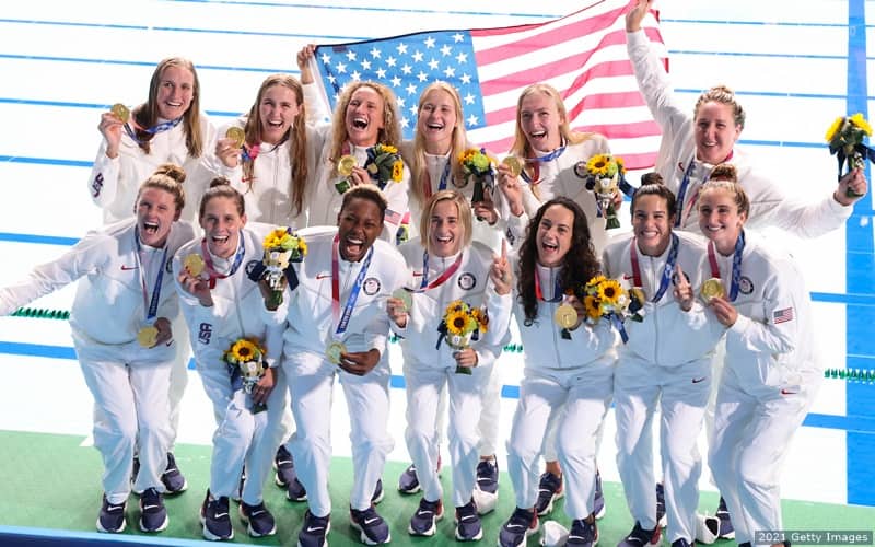 The U.S. women's water polo team celebrates winning gold at the 2020 Olympic Games.