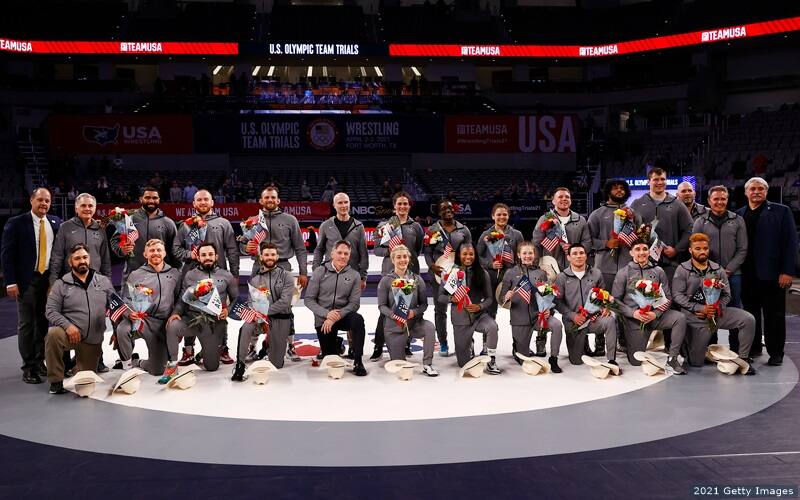 U.S. wrestlers who qualified for the 2020 Tokyo Olympic Games pose on the mat at the U.S. trials. 