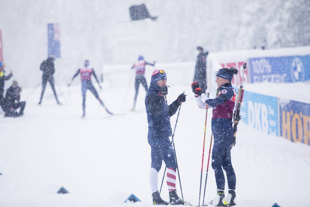 US athlete Joanne Reid talks strategy with coach Armin Auchentaller on Thursday in Hochfilzen