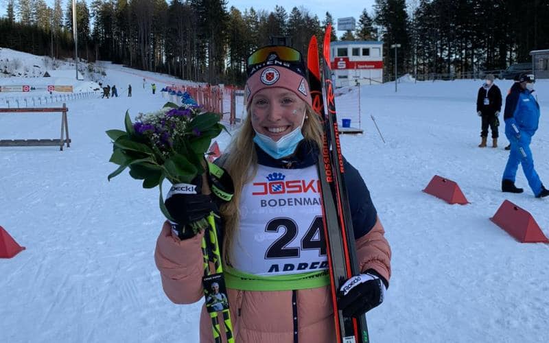 Maddie Phaneuf poses with a bouquet of flowers after finishing fourth in the women's sprint at the IBU Cup in Arber, Germany (photo by Mike Gibson)