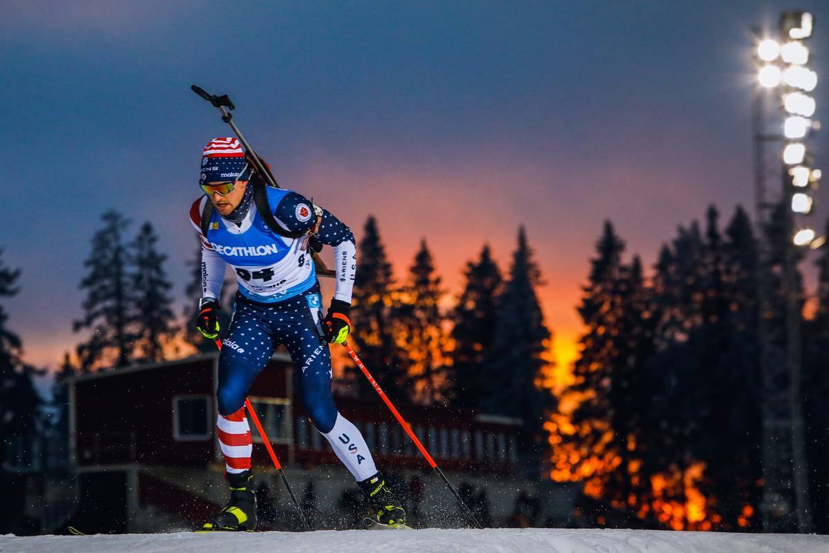 Sean Doherty races with sunset and evergreen trees in the background