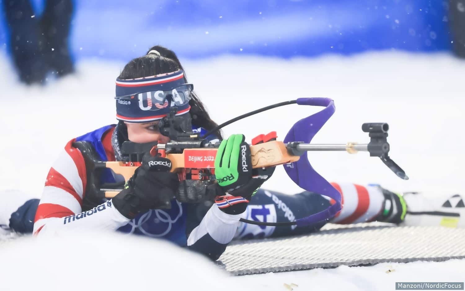 Joanne Reid shoots from the prone position during the women's pursuit at the Beijing 2022 Winter Games on Feb. 13, 2022.