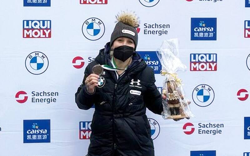 Kaillie Humphries celebrates her bronze medal