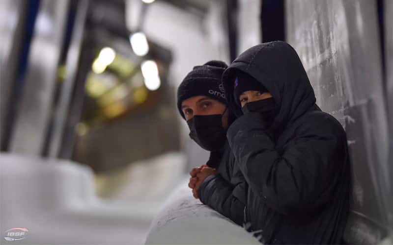 Jack Thomas and Megan Henry watch training runs in Winterberg