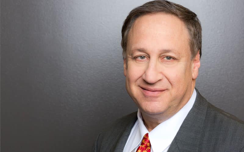 Headshot of Adam Aron