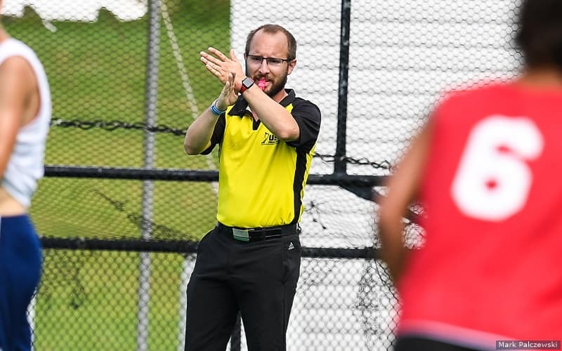 USA Umpire Ridge Bair officiates at a 2021 Young Men's National Championship game in Virginia Beach, Virginia
