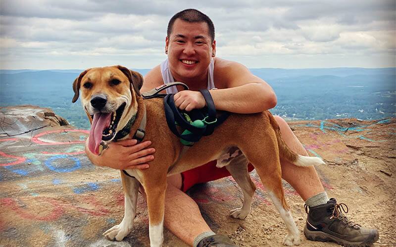 Emet Marwell, transgender activist and former field hockey player, with his dog