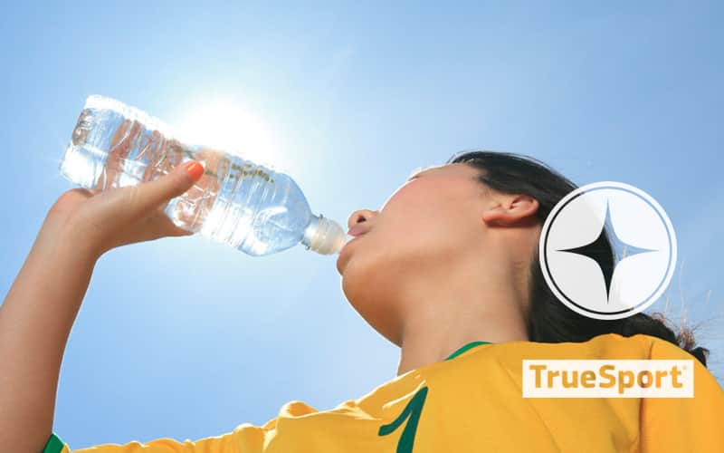 Athlete drinking water with TrueSport logo