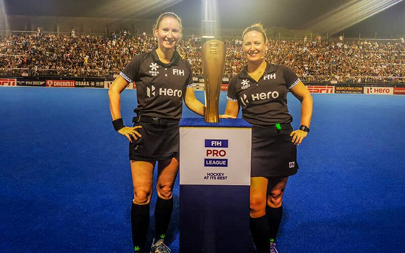 Photo of Maggie Giddens with FIH Hockey Pro League trophy