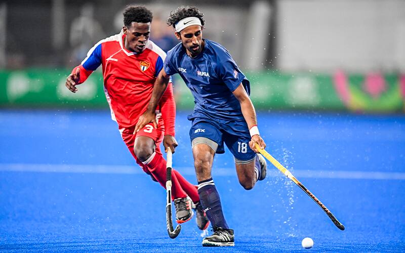 Paul Singh dribbles around a Cuba defender at the 2019 Pan American Games Quarterfinals