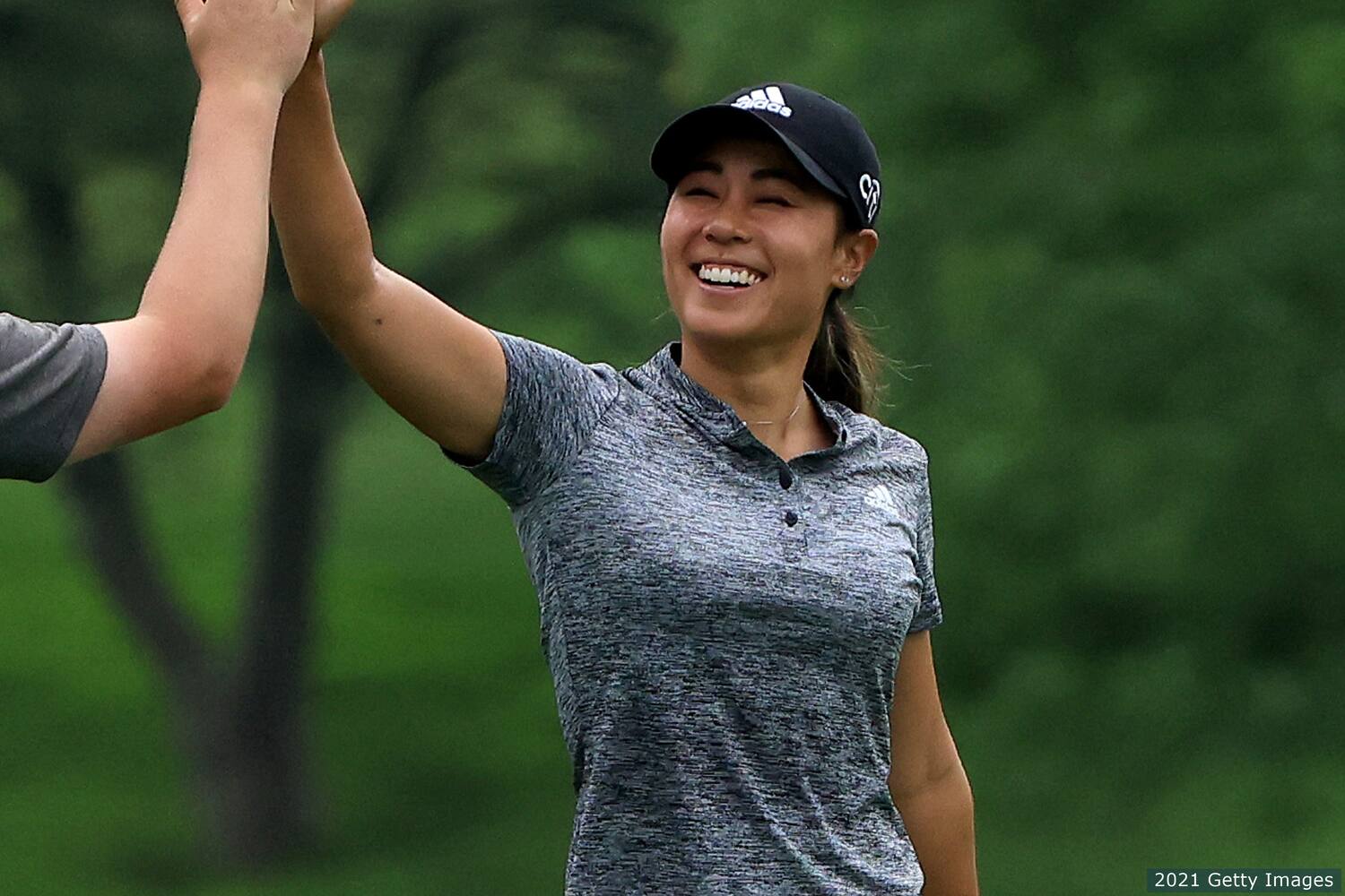 Danielle Kang high-fives. 