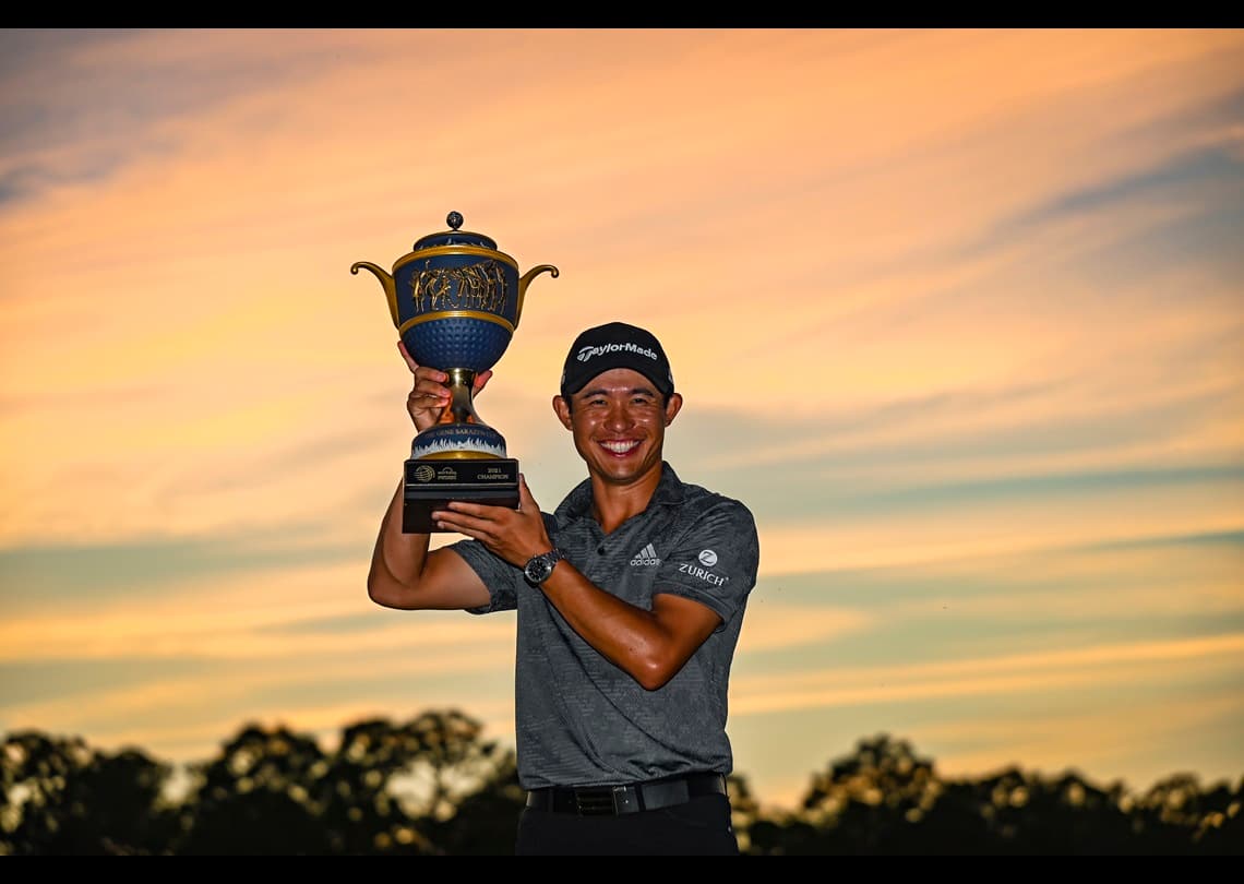 Morikawa hoists trophy after winning WGC-Workday.