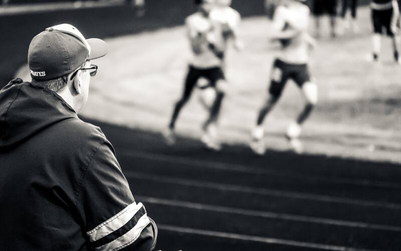 Image of parent looking at field