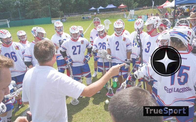 Coach and Athletes Huddle