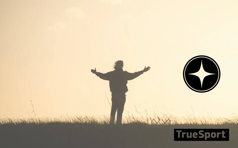 Holding Hands up in Field