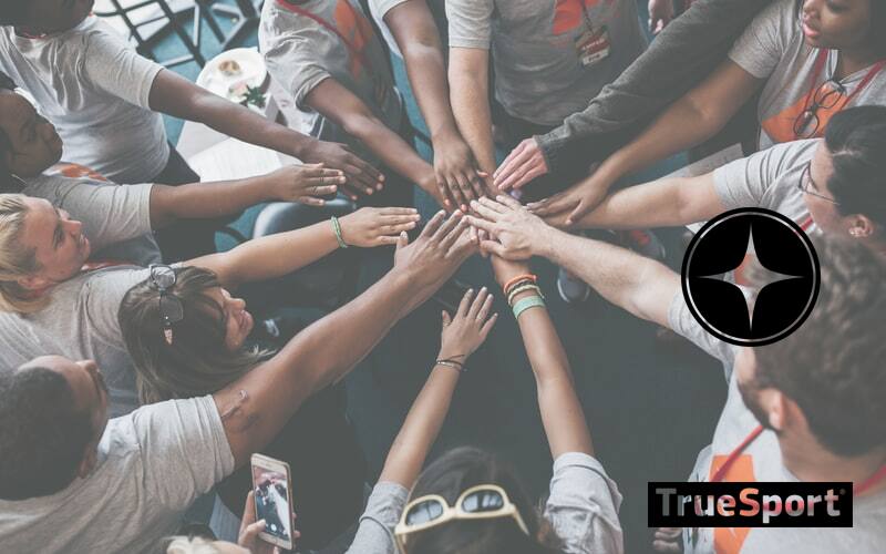 Team Huddle with Hands Together in Center