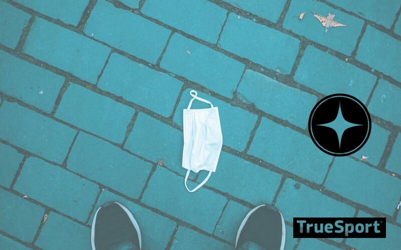 Teal brick with blue reusable mask sitting on top