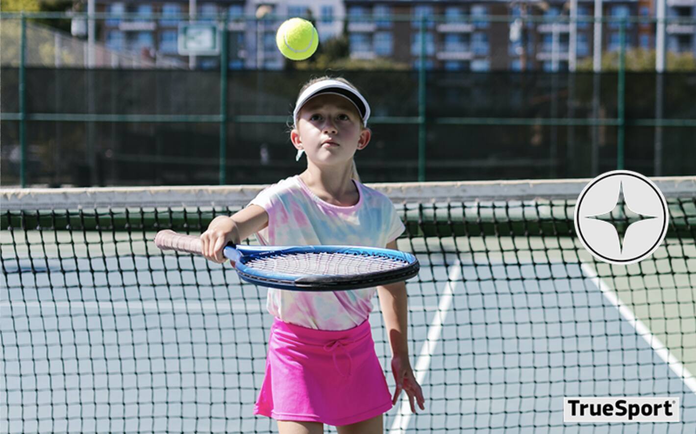youth athlete playing tennis