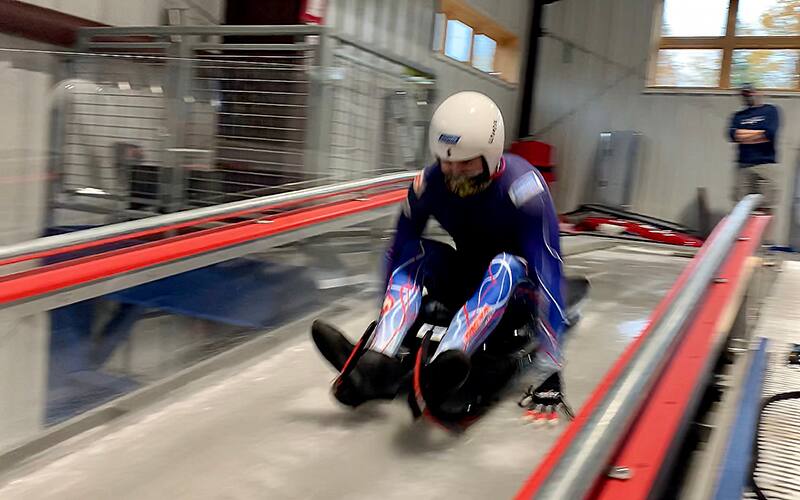 Tucker West doing a luge start