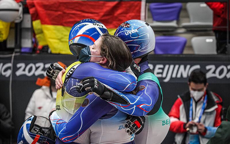 members of the USA Luge relay squad at the finish line. 