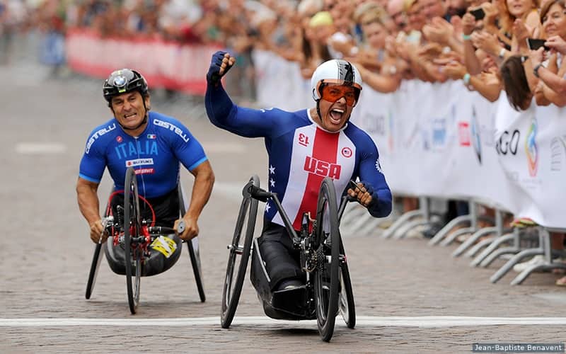 Oz Sanchez pumps his fist in the air after winning the men's handcycle team relay at the 2018 UCI Para-cycling Road World Championships